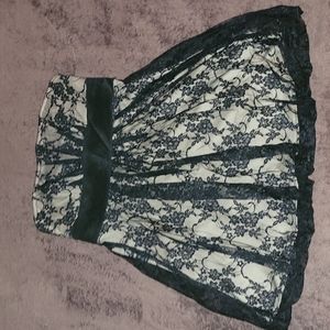 Short black dress with floral lace made by speekless